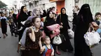 Warga Palestina mulai meninggalkan Shujayeh menyusul serangan militer Israel, (20/7/2014). (REUTERS/Finbarr O'Reilly)