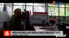 Nampak terlihat di SDN 1 Kare, Kabupaten Madiun, Jawa Timur, para murid mulai kembali belajar tatap muka, di sekolah dengan menerapkan protokol kesehatan pada Senin pagi (14/12).