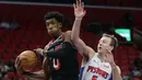 Pemain Miami Heat, Josh Richardson (0)  mencoba melewati adangan pemain Detroit Pistons, Luke Kennard (5) pada laga NBA basketball game di Little Caesars Arena, Detroit, (12/11/2017). Detroit Pistons menang 112-103. (AP/Duane Burleson)