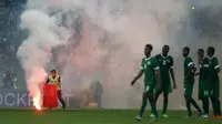 The match was disrupted by flares and fights in the stands minutes before the final whistle was blown, according to local media. REUTERS/Olivia Harris