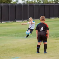 Ilustrasi anak disabilitas bermain bola. Photo by NeONBRAND on Unsplash