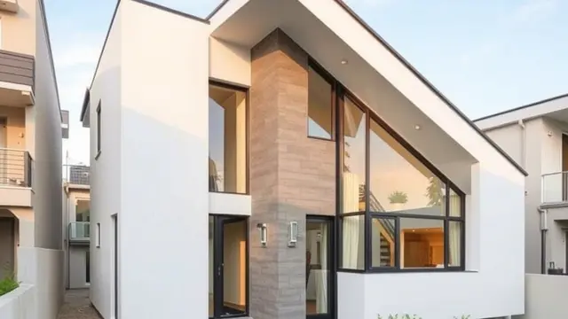 Rumah Atap Miring dengan Dinding Kaca