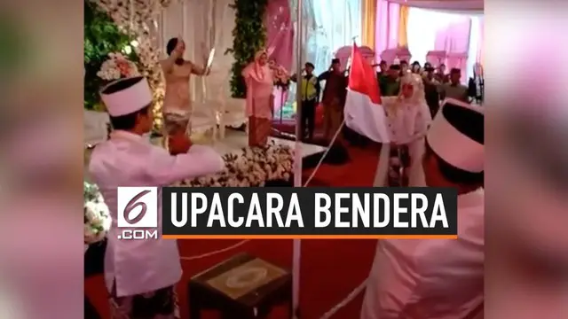 Viral video pasangan pengantin yang melakukan upacara bendara di acara pernikahan mereka.