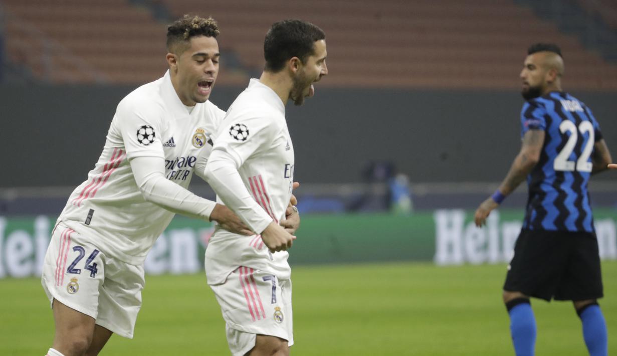 Penyerang Real Madrid, Eden Hazard, melakukan selebrasi usai mencetak gol ke gawang Inter Milan pada laga lanjutan Liga Champions di Giuseppe Meazza, Kamis (26/11/2020) dini hari WIB. Real Madrid menang 2-0 atas Inter Milan.