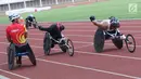 Sejumlah atlet WheelChair Racing Asian Para Games 2018 beradu cepat saat latihan di Stadion Madya, Kompleks GBK, Jakarta, Kamis (4/10). Asian Para Games 2018 berlangsung di Jakarta, 6-13 Oktober. (Liputan6.com/Helmi Fithriansyah)