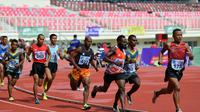 Atlet tuan rumah Papua Abraham Elopere menjadi peraih emas pertama Pekan Paralimpiade Nasional (Peparnas) Papua 2021, Sabtu (6/11/2021). (NPC Indonesia)