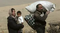 Kaburnya 2.400 warga dari Mosul di lakukan di tengah-tengah pertempuran pasukan pemerintah melawan ISIS. (AP)