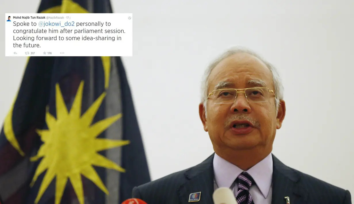 Melalui Twitter, PM Malaysia menulis, "Selamat untuk @jokowi_do2 yang memenangkan pemilihan presiden Indonesia. Berharap bisa menegaskan kembali hubungan biltateral dan menanti bertemu Anda." (REUTERS/Olivia Harris)