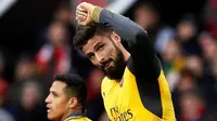 Ekspresi striker Arsenal, Olivier Giroud, setelah mencetak gol balasan di menit ke-89 ke gawang MU dalam laga Premier League di Stadion Old Trafford, Sabtu (19/11/2016). (Reuters/Phil Noble)