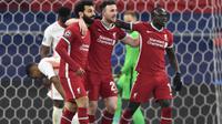 Liverpool meraih kemenangan 2-0 atas RB Leipzig pada laga leg kedua 16 besar Liga Champions di Puskas Arena, Budapest, Kamis (11/3/2021) dini hari WIB. Hasil itu membuat The Reds berhak lolos ke perempat final dengan agregat 4-0. (AFP/Attila Kisbenedek)