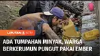 Tumpahan minyak mentah di ruas jalan Kawasan Berikat Nusantara, Marunda, Cilincing, Jakarta Utara, diserbu warga. Bahkan minyak yang mengalir di saluran air juga jadi incaran warga.