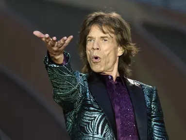 Band legendarily The Rolling Stones dikabarkan akan melakukan serangkaian tur Amerika pada musim panas nanti. Foto diambil saat konser di Paris, Juni 2014. (AFP Photo/Eric Feferberg)