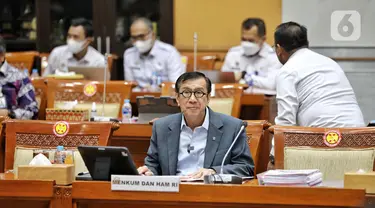 Menteri Hukum dan HAM Yasonna Laoly saat mengikuti rapat kerja dengan Komisi III DPR RI di Kompleks Parlemen, Senayan, Jakarta, Kamis (25/8/2022). Rapat tersebut membahas LKPP APBN TA 2021 serta LHP BPK 2021. Liputan6.com/Angga Yuniar