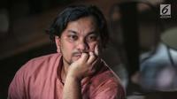 Penyanyi sekaligus dokter bedah, Tompi memberi keterangan terkait wajah bengkak Ratna Sarumpaet di Jakarta, Rabu (3/10). Tompi mengatakan, benar tidaknya wajah bengkak Ratna akibat penganiayaan merupakan ranah pihak berwajib. (Liputan6.com/Faizal Fanani)