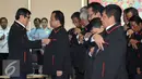 Menkumham Yasonna Laoly saat melantik tim Pengawasan Orang Asing  (PORA) di Gedung Imigrasi Kemenkumham, Jakarta (8/4). Yasonna berharap tim PORA dapat mencegah kejahatan transnasional. (Liputan.com/Helmi Afandi)