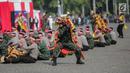 Aksi rampak gendang Polri dan TNI dalam HUT ke-73 Bhayangkara di Monas, Jakarta, Rabu (10/7/2019). HUT Bhayangkara ke-73 ini bertemakan ‘Dengan semangat Promoter, pengabdian Polri, untuk masyarakat, bangsa, dan negara. (Liputan6.com/Faizal Fanani)