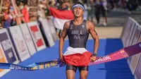 Atlet aquathlon putra Indonesia, Rashif Amila Yaqin, berhasil menjadi yang tercepat di nomor individual aquathlon putra dan menjadi peraih medali emas pertama Indonesia di SEA Games 2023. (Bola.com/Dok: NOC Indonesia/Rizki Fitrianto)
