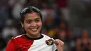 Gregoria Mariska Tunjung menutup set kedua dengan keunggulan 21-9. (ARUN SANKAR/AFP)