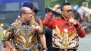 Mantan Menpora, Imam Nahrawi batik merah keluar menjalankan salat jumat saat proses penyidikan di Gedung KPK, Jakarta, Jumat (27/09/2019). Imam Nahrawi diperiksa sebagai tersangka dalam kasus dugaan suap dana hibah dari pemerintah terhadap KONI melalui Kemenpora. (merdeka.com/Dwi Narwoko)