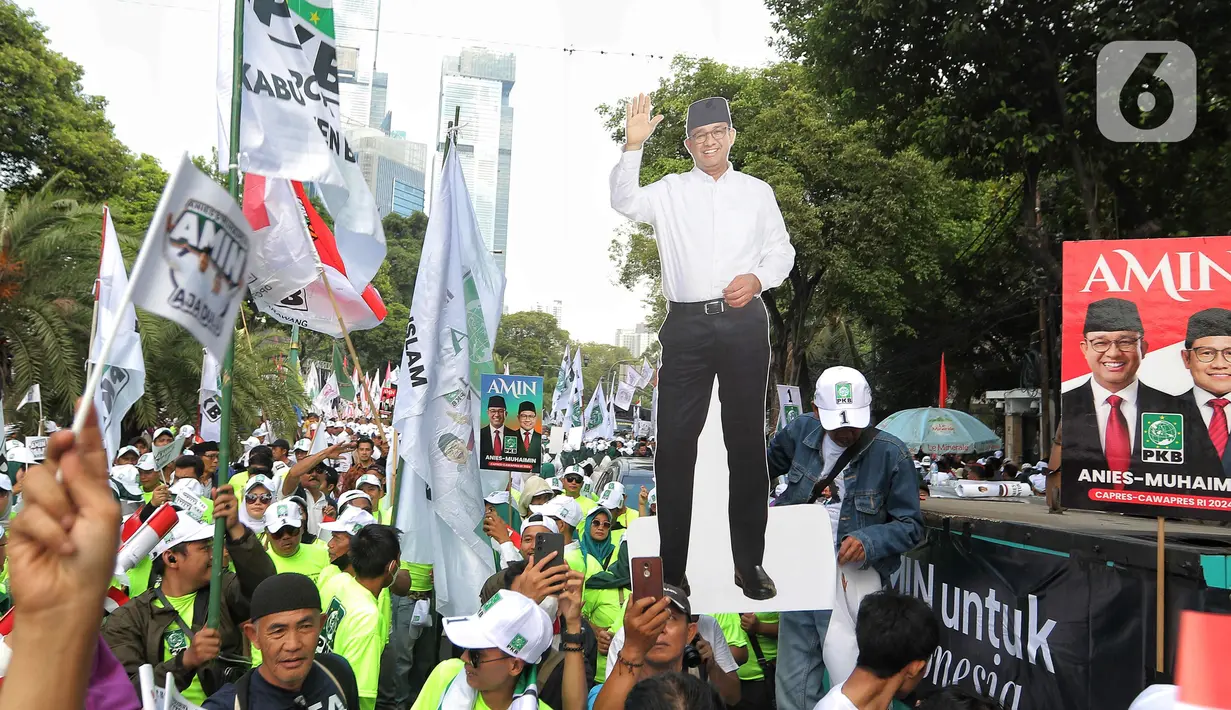 Massa juga membentangkan spanduk dengan gambar wajah Anies dan Cak Imin. (Liputan6.com/Angga Yuniar)