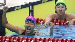 Syuci Indriani perenang Indonesia berhasil meraih medali emas di nomor 100 meter gaya dada klasifikasi SB14 pada Asian Para Games 2018, Gelora Bung Karno Jakarta, Senin (8/10/2018).  (Bola.com/Peksi Cahyo)