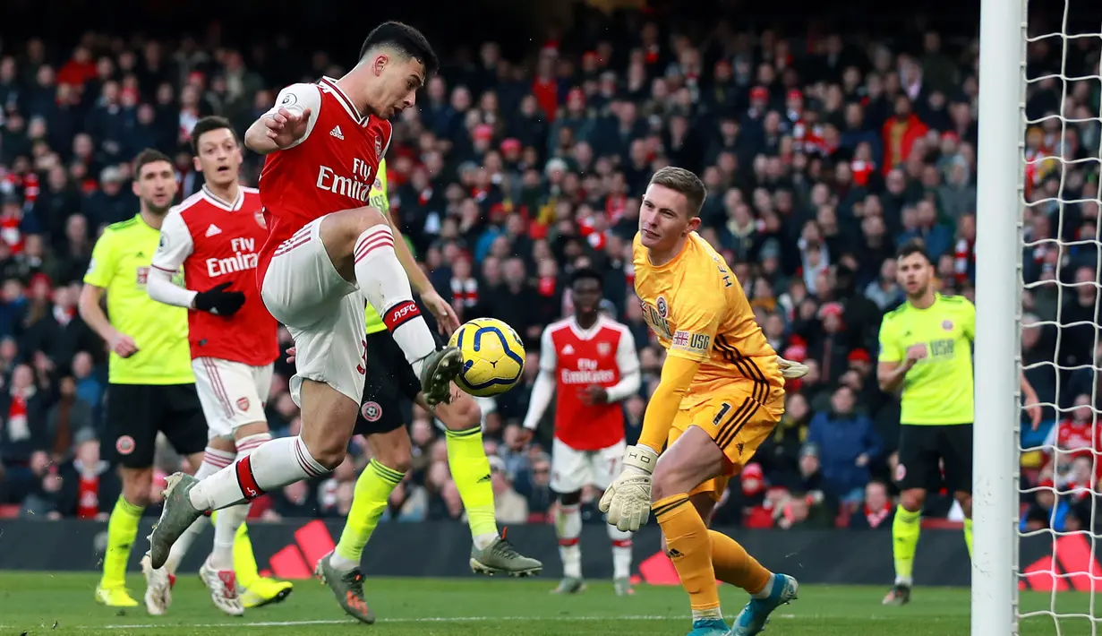 Pemain Arsenal Gabriel Martinelli mencetak gol ke gawang Sheffield United pada pertandingan Liga Inggris di Emirates Stadium, London, Inggris, Sabtu (18/1/2020). Pertandingan berakhir 1-1. (Adam Davy/PA via AP)
