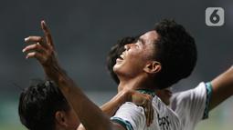 Pemain belakang Timnas Indonesia U-19, Muhammad Ferrari merayakan golnya pada laga grup A Piala AFF U-19 2022 melawan Myanmar U-19 di Stadion Patriot Candrabhaga, Bekasi, Jawa Barat, Minggu (10/7/2022). Meski berhasil menundukkan Myanmar U-19 dengan skor 5-1, namun Timnas Indonesia U-19 gagal melaju ke semifinal. (Liputan6.com/Helmi Fithriansyah)