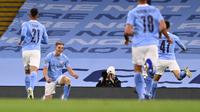 Penyerang Manchester City, Liam Delap (kiri kedua) berselebrasi usai mencegak gol ke gawang Bournemouth pada pertandingan putaran ketiga Piala Liga Inggris di City of Manchester Stadium di Manchester, Inggris, Kamis (24/9/2020). City menang tipis atas Bournemouth 2-1. (Laurence Griffiths/Pool via AP