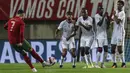 Timnas Portugal berhasil meraih kemenangan 3-0 atas Qatar pada laga uji coba di Estadio Algarve, Minggu (10/10/2021) dini hari WIB. Satu dari tiga gol Portugal disarangkan Cristiano Ronaldo. (AFP/Carlos Costa)