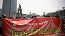 Sejumlah massa dari para nelayan melakukan aksi unjuk rasa damai di Bundaran HI, Jakarta, (15/10/14). (Liputan6.com/Faizal Fanani)