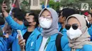 Mahasiswa dari berbagai universitas melakukan aksi unjuk rasa di kawasan Patung Kuda, Jakarta, Senin (4/11/2022). Mereka menyampaikan tuntutannya terkait kenaikan minyak goreng dan bahan bakar minyak (BBM). (Liputan6.com/Herman Zakharia)
