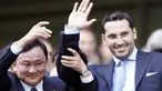 Manchester City's Thai owner Thaksin Shinawatra (L) holds up the hand of new chairman designate Khaldoon Al Mubarak before their EPL football match at The City of Manchester Stadium in Manchester on September 21, 2008. AFP PHOTO/PAUL ELLIS