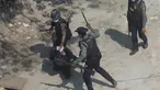 Petugas polisi anti huru hara menahan seorang pengunjuk rasa ketika mereka membubarkan demonstrasi di Kotapraja Tharkata di pinggiran Yangon, Myanmar, Sabtu (6/3/2021). PBB Myanmar mengecam tindakan kekerasan aparat terhadap pendemo dalam aksi damai menolak kudeta  militer. (AP Photo)