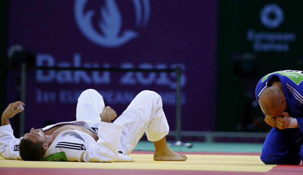 Ekspresi pejudo Belanda, Henk Grol (kanan), setelah mengalahkan Lukas Krpalek dari Republik Ceska di kelas 100 kg judo Pesta Olah Raga Eropa 2015 di Baku, Azerbaijan. (27/6). (REUTERS/Stoyan Nenov)