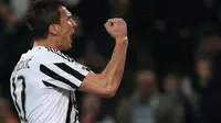 Ekspresi striker Juventus, Mario Mandzukic usai mencetak gol ke gawang Empoli pada pertandingan lanjutan Serie A, di Stadion Juventus, Sabtu atau Minggu (3/4/2016) dini hari WIB. (AFP/Marco Bertorello).