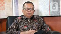 Calon hakim Mahkamah Konstitusi (MK) Arsul Sani berpose usai wawancara khusus dengan Liputan6.com di Jakarta, Kamis (11/1/2024). (Liputan6.com/Herman Zakharia)
