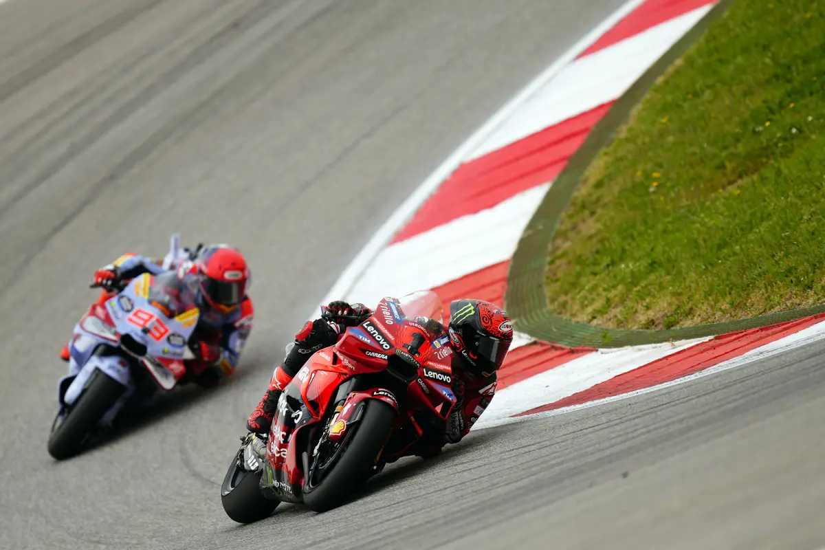 Francesco Bagnaia dan Marc Marquez di MotoGP 2024