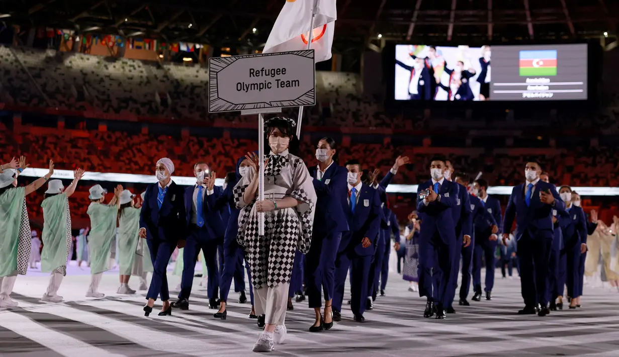 Terbaru, Yusra Mardini dipercaya membawa panji kebesaran Tim Pengungsi Olimpiade pada upacara pembukaan Olimpiade Tokyo 2020 bersama Tachlowini Gabriyesos. Sebuah kebanggan tersendiri baginya dapat memimpin barisan rombongan Tim Pengungsi. (Foto: AFP/Odd Andersen)