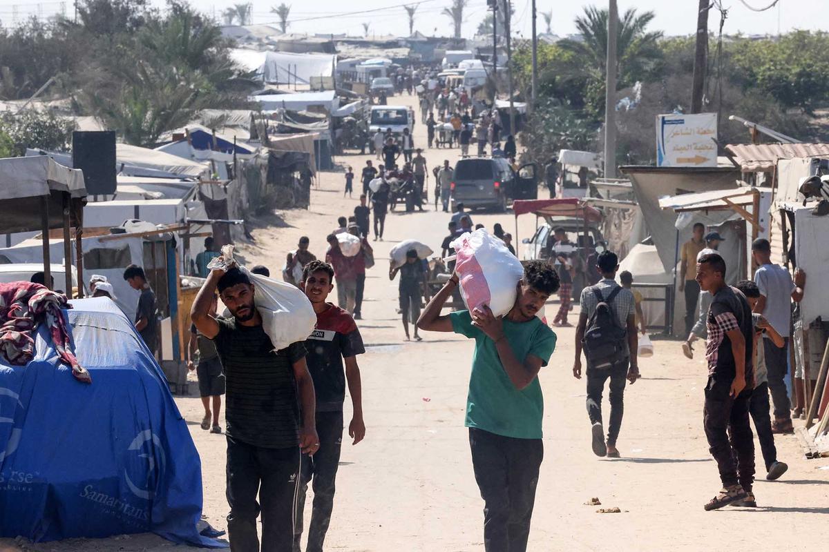 FOTO:  Israel Umumkan Jeda Taktis, Truk Bantuan Mulai Masuk Gaza