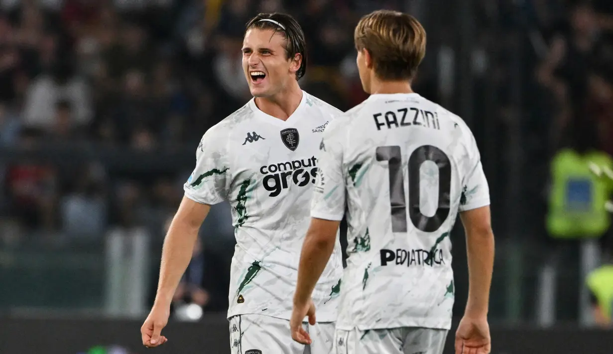 Empoli berhasil menggandakan keunggulan lewat gol Lorenzo Colombo yang dicetak dari titik putih pada menit ke-60. (Alberto PIZZOLI/AFP)