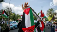 Massa Gerakan Pekerja Muslim Indonesia (GPMI) melakukan aksi solidaritas untuk Palestina di kawasan Thamrin Jakarta, Jumat (28/5/2021). Mereka menyuarakan keprihatinan atas tragedi kemanusiaan di Palestina, serta mewujudkan perdamaian dunia dan kemerdekaan atas Palestina (Liputan6.com/Faizal Fanani)