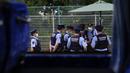 Polisi berkumpul dekat pusat pers utama Olimpiade 2020 di Tokyo, Jepang, Rabu (14/7/2021). Keadaan darurat akan berlaku sepanjang Olimpiade yang dibuka pada 23 Juli. (AP Photo/Jae C. Hong)