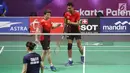 Ganda campuran Indonesia, Tontowi Ahmad/Liliyana Natsir saat melawan Lee Chun Hei R/Chau Hoi Wah (Hong Kong) di perempat final Bulutangkis Asian Games 2018 di Istora Kompleks GBK, Jakarta, Sabtu (25/8). (Liputan6.com/Helmi Fithriansyah)