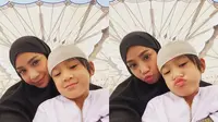 Nagita Slavina mengenakan hijab hitam saat umrah bersama Raffi Ahmad dan Rafathar (Dok.Instagram/@raffinagita1717/https://www.instagram.com/p/B8nr20zB1Tk/Komarudin)