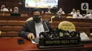 Mendes PDTT Abdul Halim Iskandar bersiap mengikuti rapat kerja dengan Komisi V DPR di Senayan, Jakarta, Senin (11/4/2022). Rapat membahas isu-isu terkait desa tertinggal serta rekruitmen Tenaga Pendamping Desa. (Liputan6.com/Angga Yuniar)