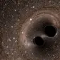 Sebuah simulasi komputer mengenai pertemuan lubang hitam (NASA Jet Propulsion Laboratory)