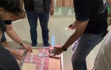 Terbongkar! Produksi Uang Palsu Rp100 Ribu di Kamar Hotel Bogor