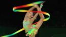 Pesenam asal Australia, Alexandra Bogatyreva-Kiroi menunjukkan atraksinya dengan memainkan pita selama babak kualifikasi Senam Ritmik Commonwealth Games 2018 di Gold Coast, Australia, Rabu (11/4). (AP Photo/Manish Swarup)