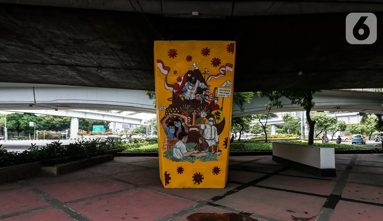Mural imbauan untuk melawan COVID-19 terlihat di bawah kolong jembatan di Jakarta, Kamis (17/11/2020). Airlangga mengajak seluruh stakeholder maupun civitas akademi untuk bersama-sama mengendalikan penyebaran Covid-19. (Liputan6.com/JohanTallo)