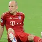 Penjualan jersey dari Bayern Munchen berada pada posisi kelima dengan angka 880.000 per tahun. Jersey bernama Arjen Robben menjadi salah satu yang terlaris. (AFP Photo/Christof Stache) 